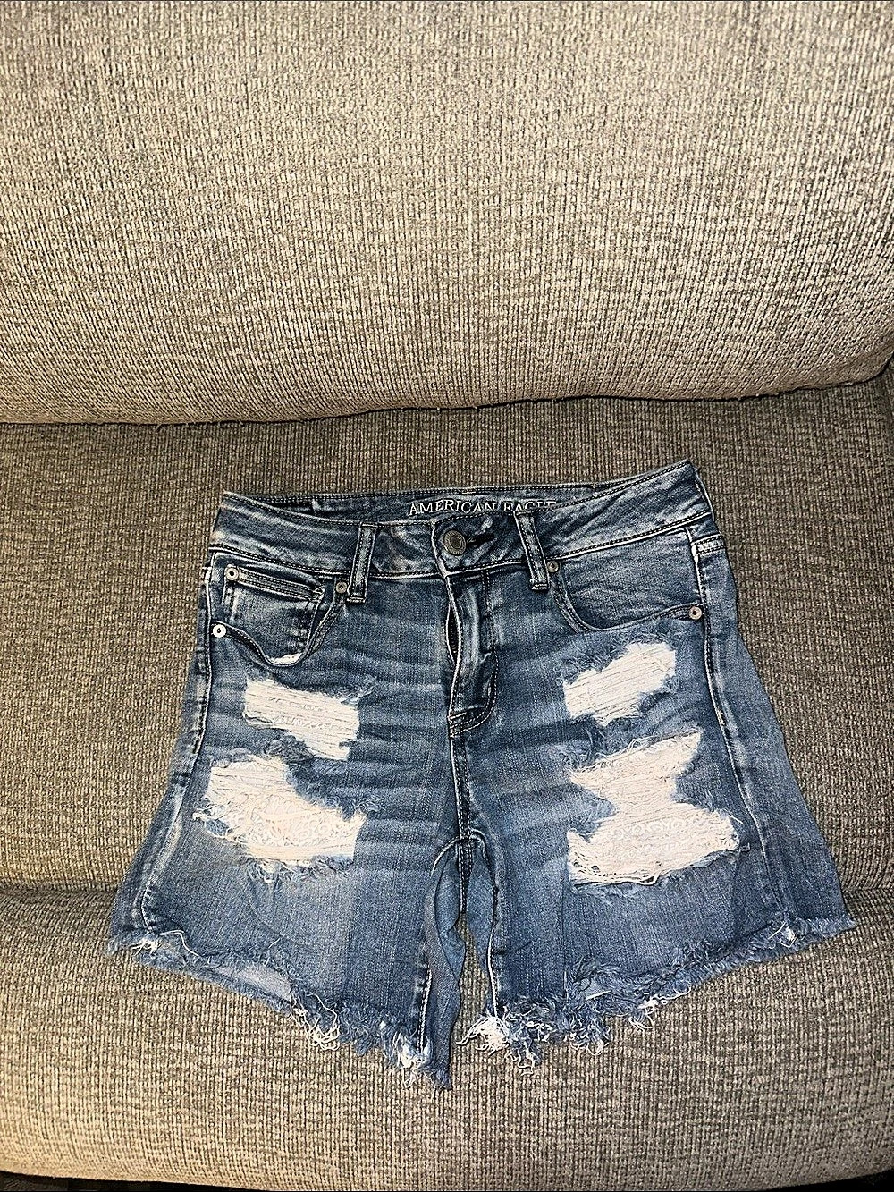 American Eagle Outfitters AE Next Level Stretch Distressed Jean Shorts in Blue